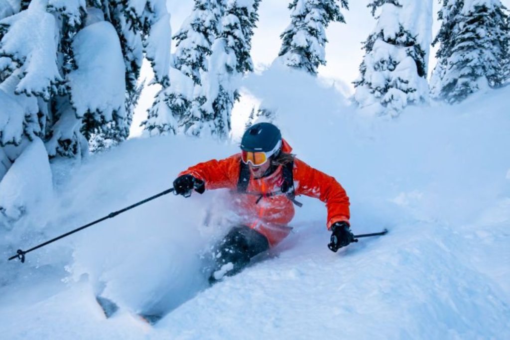 heli-skiing-canada-skier-carving-tracks-min