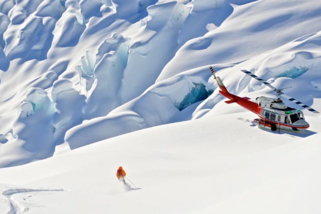 heli-skiing-canada-single-skier-on-slope-min