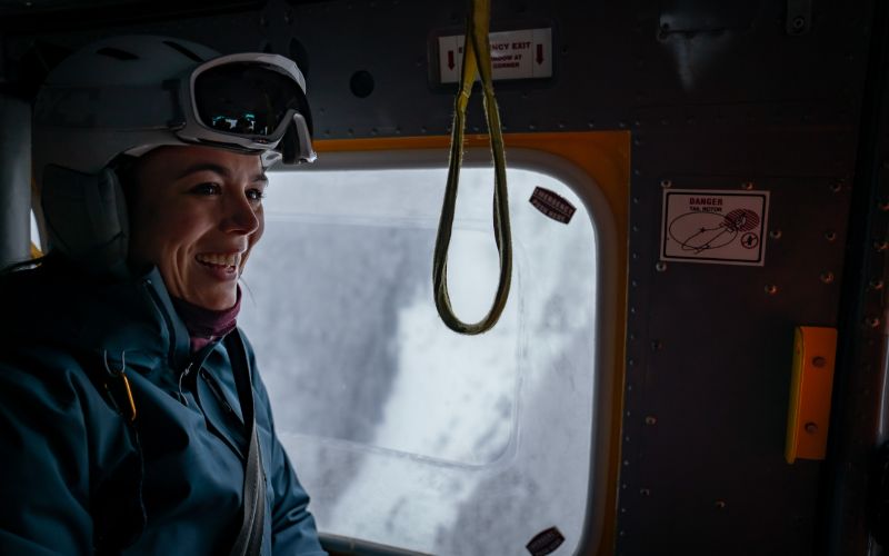 heli-skiing-canada-woman-in-helicopter-min