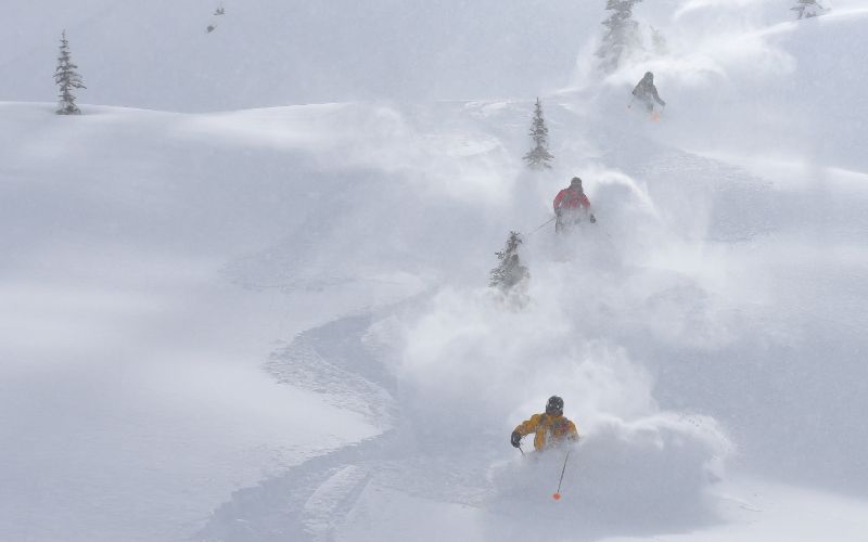 heli-skiing-canada-three-skiers-min